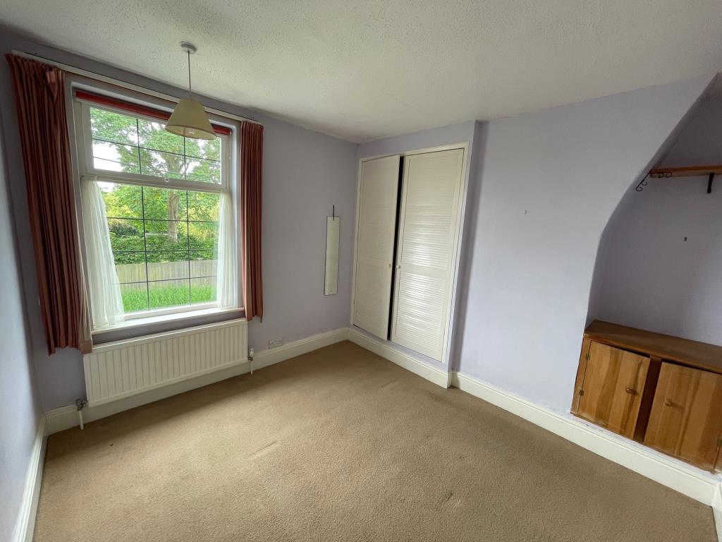 Lot: 20 - THREE-BEDROOM COTTAGE FOR IMPROVEMENT - Bedroom 1 with Window to front and cupboard